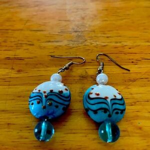 Interesting pair. Looks hand painted.  Brown is raised.